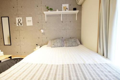 Postel nebo postele na pokoji v ubytování Daiichi Mitsumi Corporation - Vacation STAY 15270