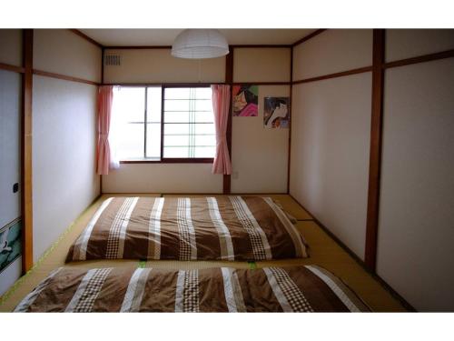 Postel nebo postele na pokoji v ubytování Corpo Marika 0 - Vacation STAY 43292v