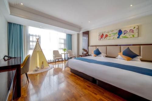 a bedroom with a large bed and a large window at Shanghai Dixuan Junlan Resort Hotel in Shanghai
