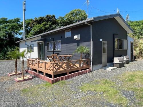a small house with a porch and a deck at racine yakushima - Vacation STAY 86828v in Ambo