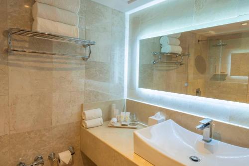 a bathroom with a sink and a mirror at Hotel El Panama by Faranda Grand, a member of Radisson Individuals in Panama City