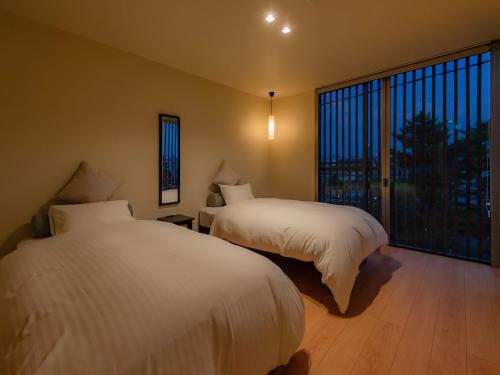 Кровать или кровати в номере ZIPANG - Vacation STAY 68242v
