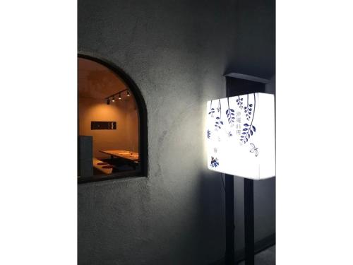 a mirror on the side of a wall next to a room at oyadoyadokari - Vacation STAY 08483v in Okayama