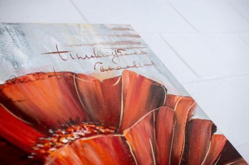 a book with a picture of a red flower at The Grampians Motel in Halls Gap