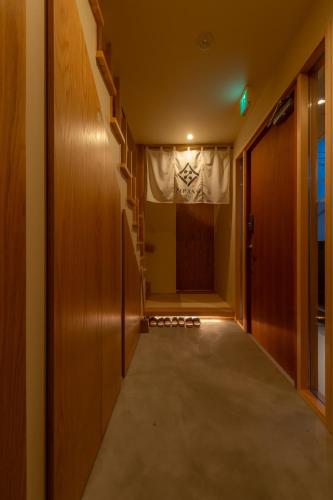 a hallway with a door and a curtain at ZIPANG - Vacation STAY 02088v in Matsue