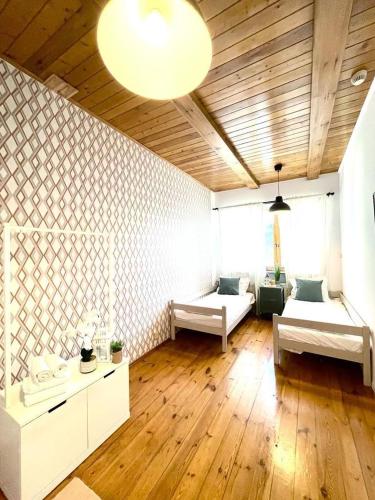a living room with two beds and a couch at Lodge in Wrocław