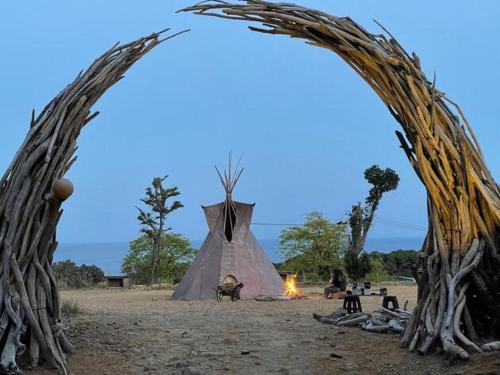 a tent with a fire in front of it at Shimanto Yamamizuki - Vacation STAY 36947v in Shimanto