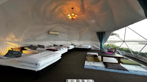 a room with three beds in a tent at Shimanto Yamamizuki - Vacation STAY 36956v in Shimanto