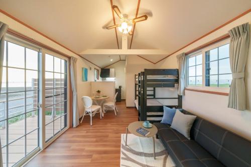 a living room with a couch and a bunk bed at Kisarazu CAMP ORGANIC FIELD in Mitate- Vacation STAY 42113v in Sakadoichiba