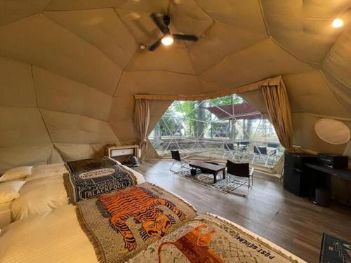 a large room with two beds and a table at The Day Post General Glamping Village Yamanakako - Vacation STAY 02721v in Yamanakako