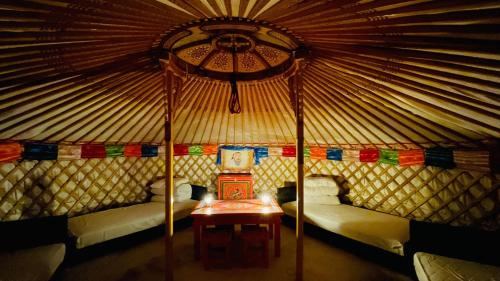 a room with a bed and a table in a yurt at Mini Mongolian Campsite - Vacation STAY 84049v in Makito