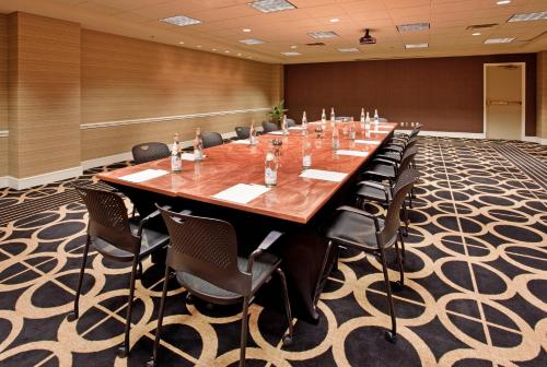 a large conference room with a long table and chairs at Crowne Plaza Kansas City Downtown by IHG in Kansas City