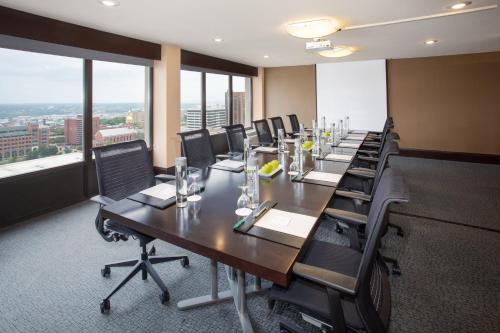 a conference room with a long table and chairs at Crowne Plaza Kansas City Downtown by IHG in Kansas City