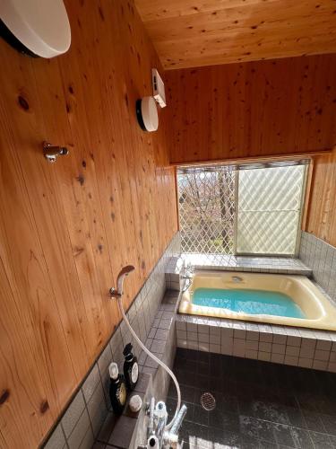 a bathroom with a bath tub with a window at MYKARIN - Vacation STAY 39160v in Nasu-yumoto