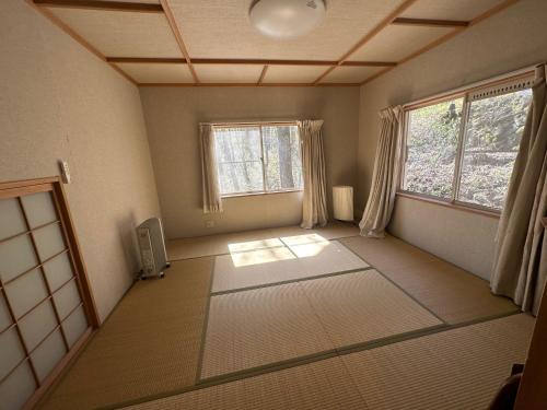 an empty room with two windows and a room with white floors at MYKARIN - Vacation STAY 39160v in Nasu-yumoto