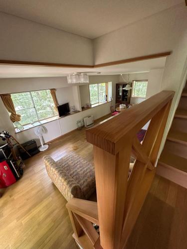 a living room with a staircase in a house at MYKARIN - Vacation STAY 39160v in Nasu-yumoto