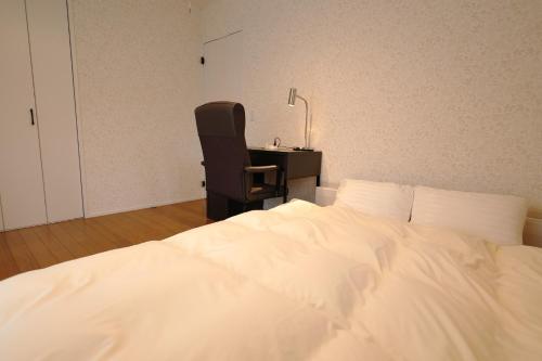 Postel nebo postele na pokoji v ubytování Saifu House - Vacation STAY 29910v