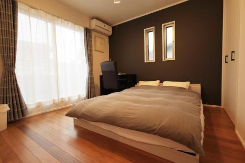 Postel nebo postele na pokoji v ubytování Saifu House - Vacation STAY 29910v