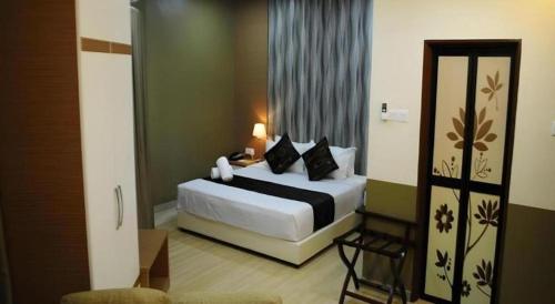 Katil atau katil-katil dalam bilik di Hotel Kobemas Melaka