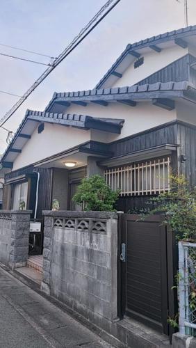 a house with a gate in front of it at Okawaya - Vacation STAY 49372v in Ōkawa