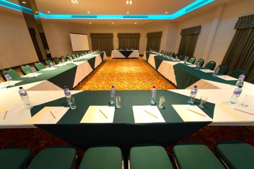 a large conference room with tables and chairs in it at Hotel Brio Inn in Ciudad Victoria