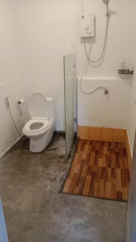 a bathroom with a toilet and a shower stall at Papaya House Koh Tao in Ko Tao
