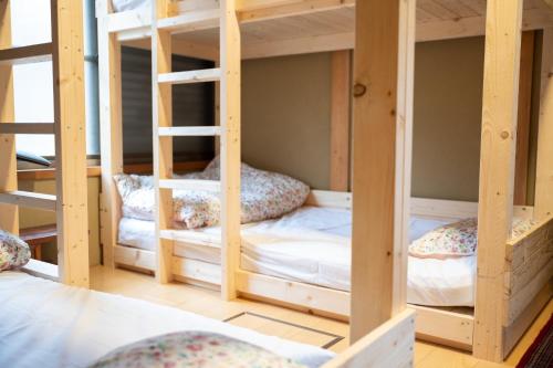 a room with four bunk beds in a room at Setouchi base - Vacation STAY 48109v in Mitoyo