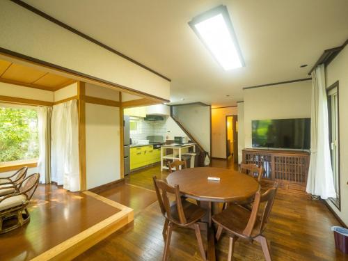a kitchen and dining room with a table and chairs at Sanso Seseragi - Vacation STAY 15301 in Nasu
