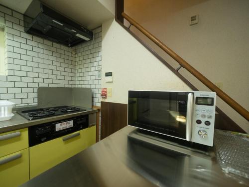 a microwave oven sitting on a counter in a kitchen at Sanso Seseragi - Vacation STAY 15301 in Nasu