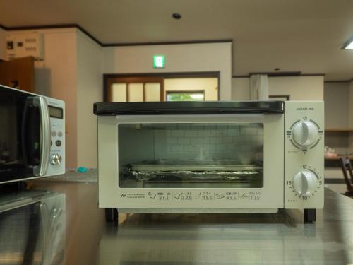 a toaster oven sitting on top of a counter at Sanso Seseragi - Vacation STAY 15301 in Nasu