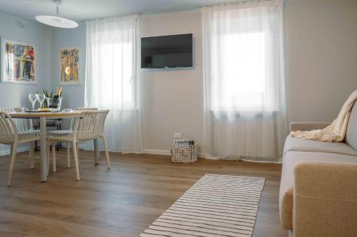 TV a/nebo společenská místnost v ubytování La Croce Apartments