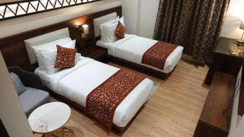 Katil atau katil-katil dalam bilik di Hotel Dayal Tower
