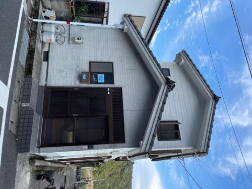 a building with windows on the side of it at Sakitsu House ZANN - Vacation STAY 55708v in Amakusa