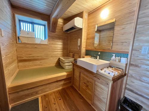 a bathroom with a sink and a mirror at Matsu no Yu Tokiwa - Vacation STAY 56390v in Yatsushiro