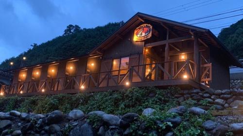a building with a sign on the side of it at Angler's Base SHIMOKITAYAMA Fishing Lodge - Vacation STAY 73805v in Kami-ikehara