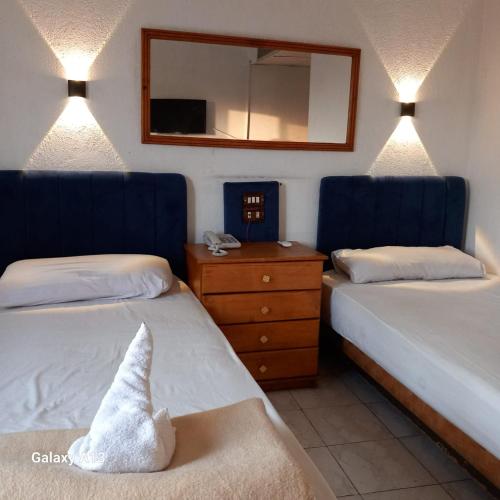 Кровать или кровати в номере Grand Memphis Hotel in Luxor