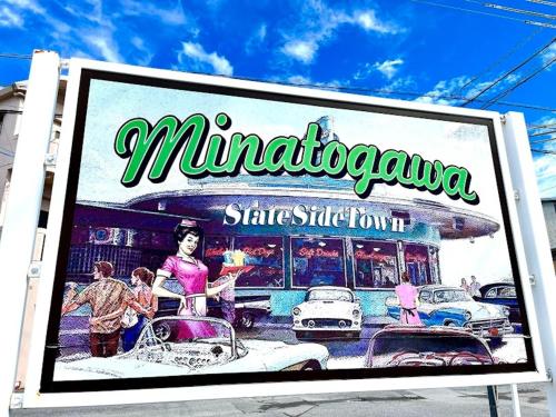 a sign for a restaurant with cars on a street at Red Dragon - Vacation STAY 15430 in Urasoe