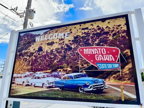 a billboard with cars parked in a parking lot at Red Dragon - Vacation STAY 15430 in Urasoe