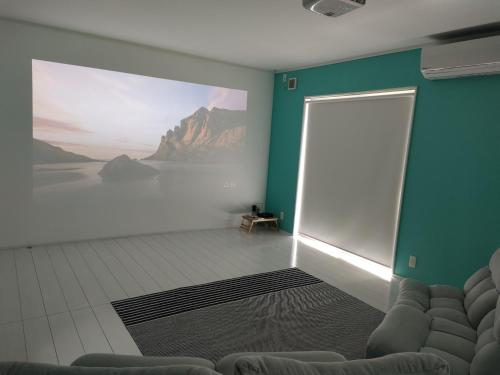 a room with a large painting on the wall at Tateyama City - Camp - Vacation STAY 42217v in Nago