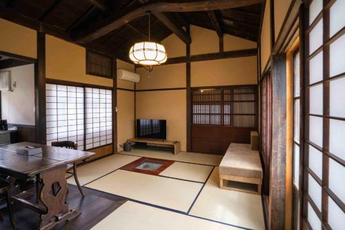a room with a table and a chair in a room at MAGONI - Vacation STAY 66651v in Kaga