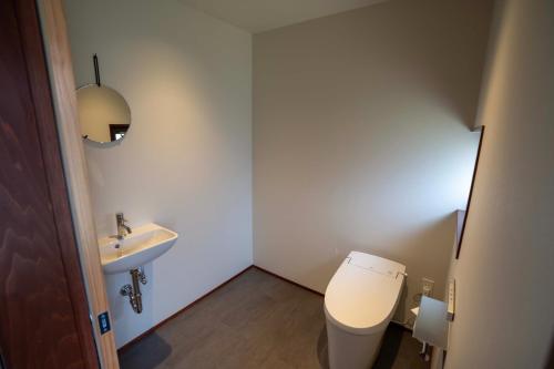 a small bathroom with a toilet and a sink at MAGONI - Vacation STAY 66671v in Kaga