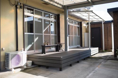 a screened in porch with a bench and a window at HanareSou - Vacation STAY 15441 in Kirishima