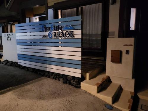 a large wall with a sign that reads end the orange at Seaside Garage Shima - Vacation STAY 77073v in Shima