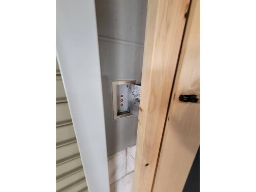 an open door with a electrical outlet in a room at Seaside Garage Shima - Vacation STAY 77073v in Shima