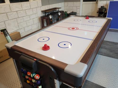 a ping pong table with six balls on it at Seaside Garage Shima - Vacation STAY 77073v in Shima