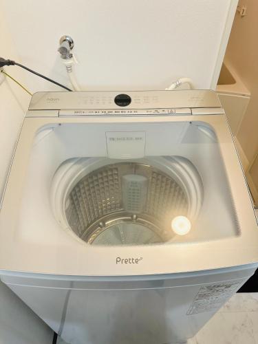 a washing machine with its door open in a room at Shirakata Token Residence 701 - Vacation STAY 76938v in Matsue