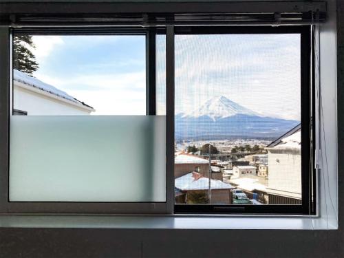a window with a view of a mountain at Asama no Iori - Vacation STAY 00952v in Fujiyoshida