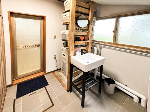 a bathroom with a sink and a mirror at Cosmo st,Inn Noboribetsu - Vacation STAY 87509v in Noboribetsu