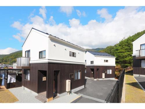 a house with white and brown at Asama no Iori - Vacation STAY 00999v in Fujiyoshida