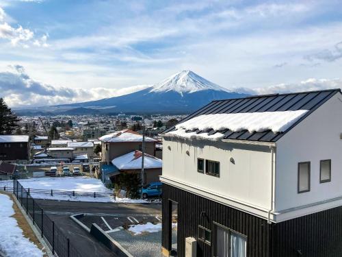 a view of a snow covered mountain in a city at Asama no Iori - Vacation STAY 00999v in Fujiyoshida